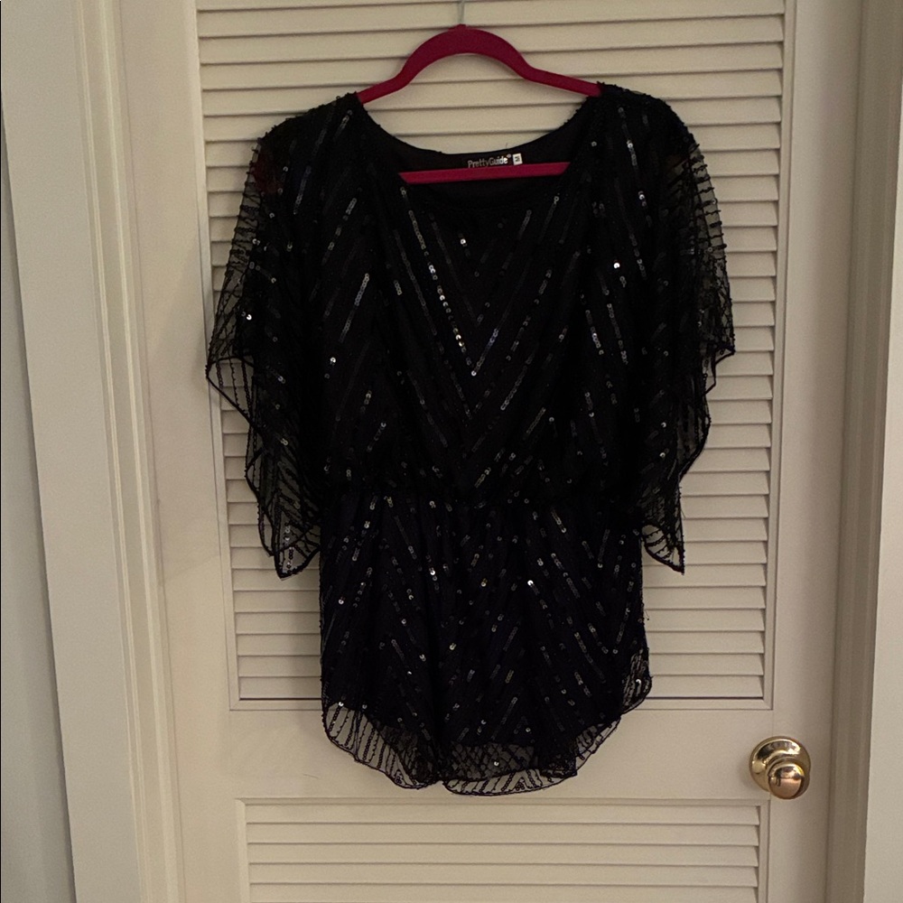 Woman’s Black Sequin Top